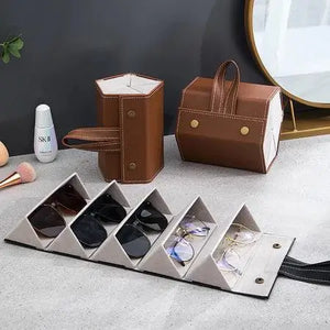 Organizador de óculos dobrável, com compartimentos individuais que protegem e mantêm os óculos organizados. Ideal para otimizar o espaço e facilitar a rotina diária, combinando praticidade e design compacto para viagens ou uso doméstico.